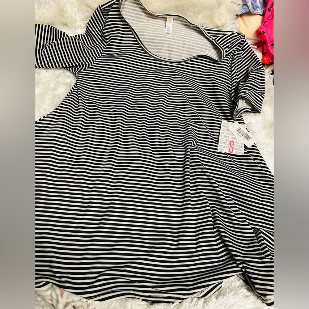 Beautiful LuLaRoe Perfect Tee with timeless, beautiful white  and black stripes!